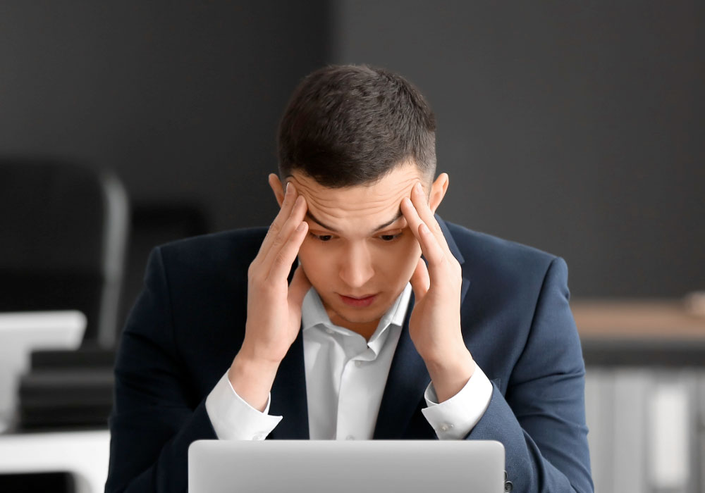 stressed out office worker at desk