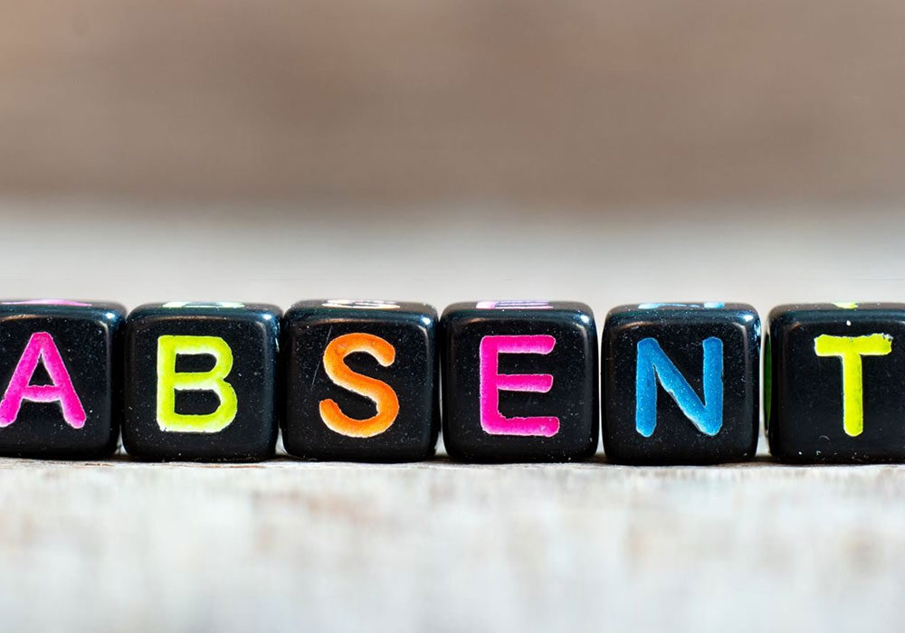 letter blocks spelling out the word absent