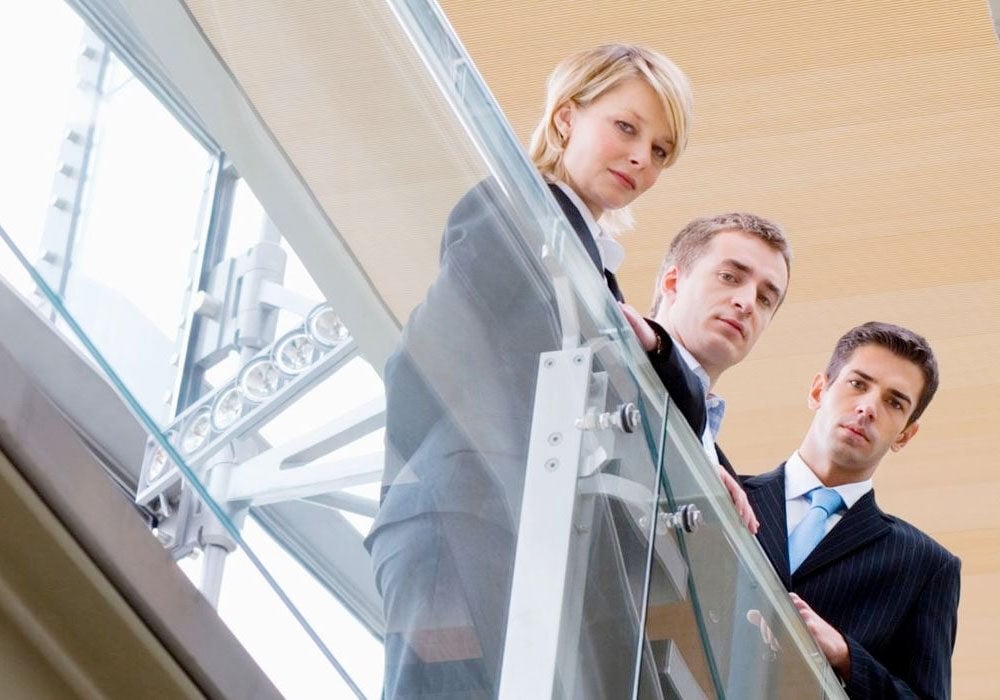 legal professional standing at top of staircase